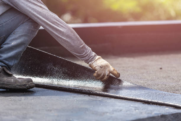 Professional Waterproofing technician working in Eagle, MI